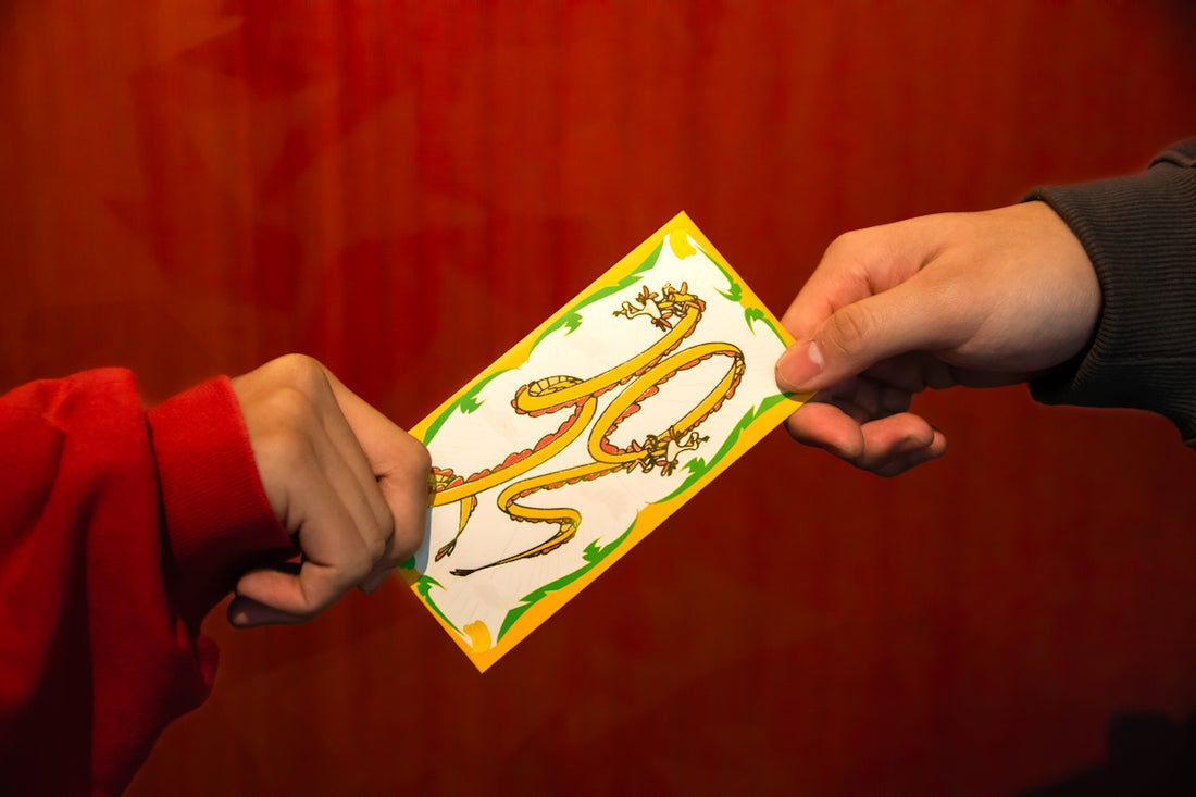 a person handing another person a piece of paper