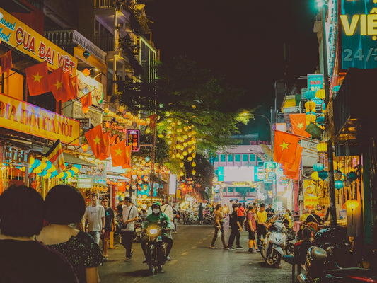 A bustling night scene in a vietnamese city.