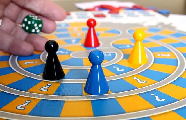 Family enjoying a trivia board game during game night