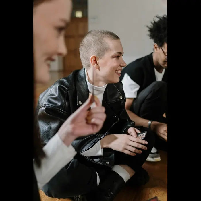 A group of friends enjoying a fun and competitive trivia night at home, with drinks and snacks 