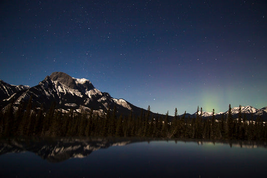 mountain across lake under nighttime