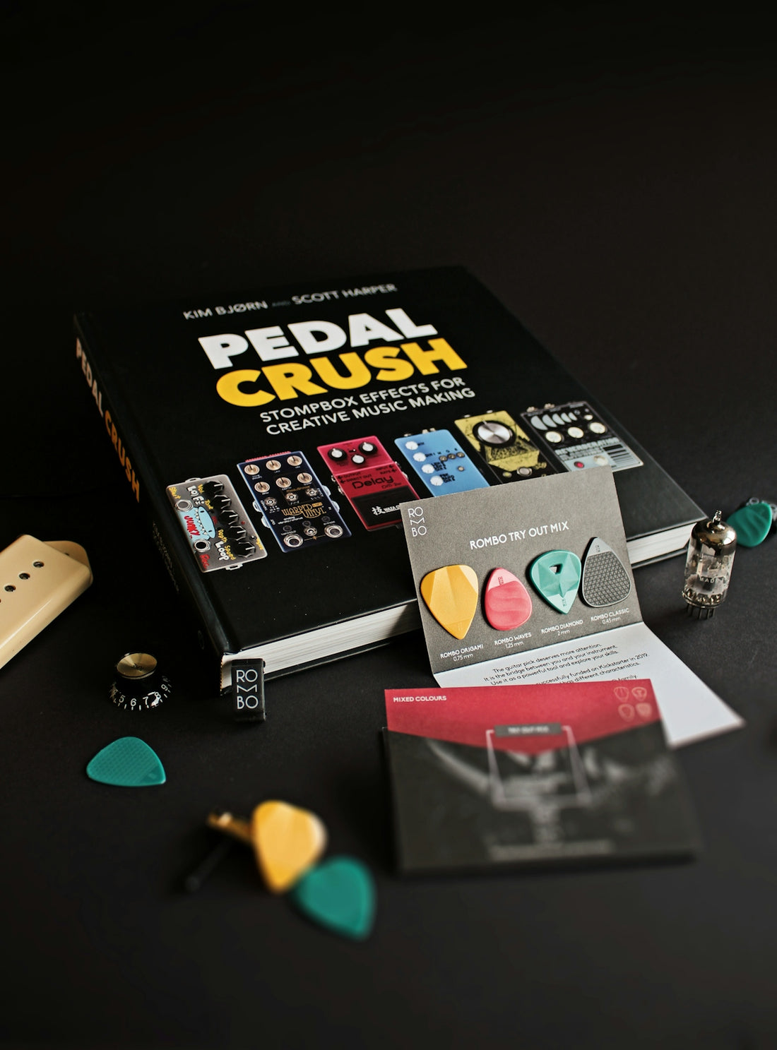 black and white labeled book beside silver macbook