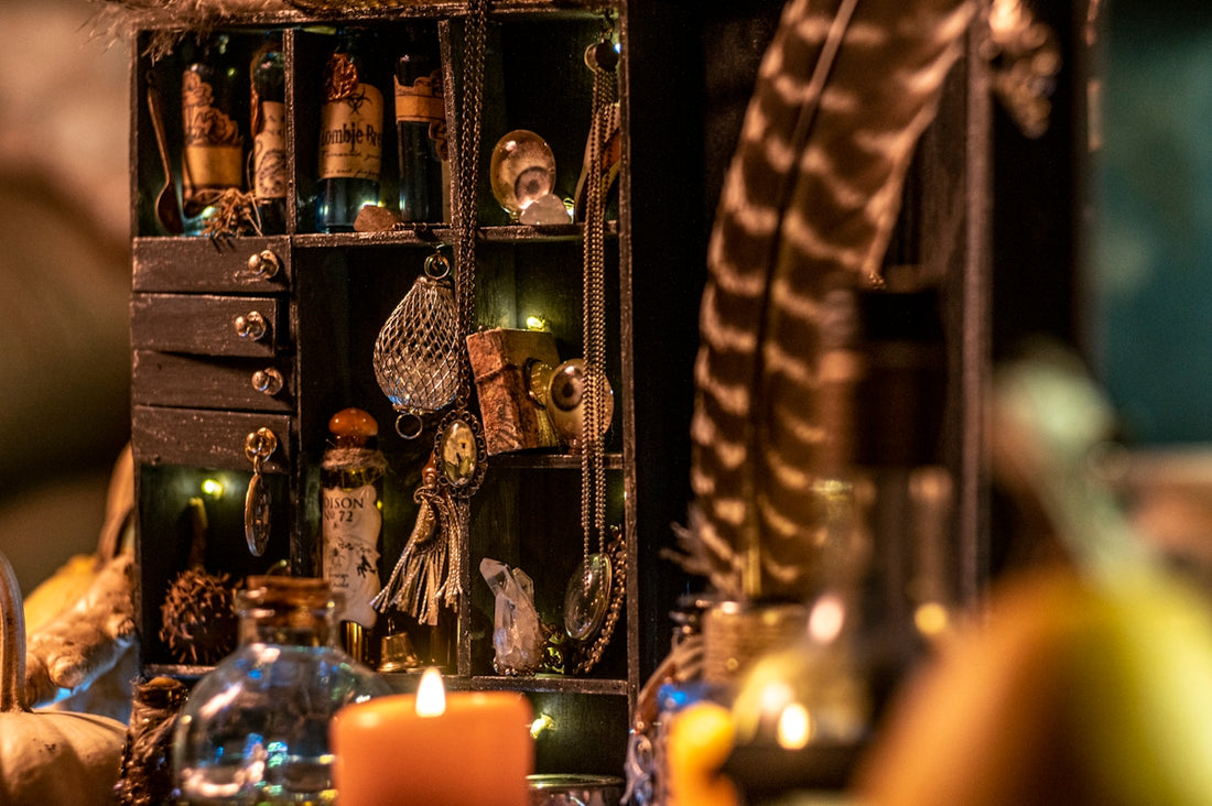 gold and white feather on glass bottle rack