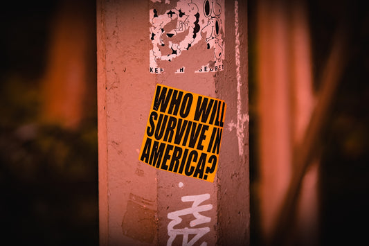 a sticker on the side of a building that says who will survive in america