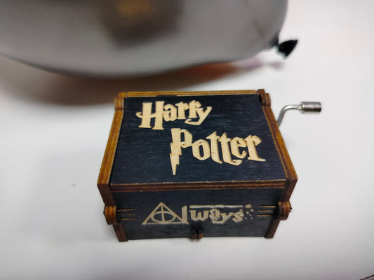 a wooden box with harry potter written on it
