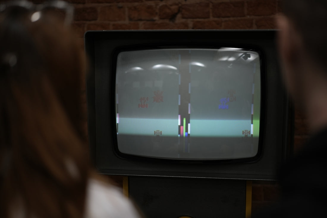 A person standing in front of a TV