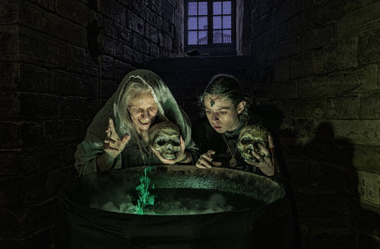 A group of people standing around a bath in a dark room